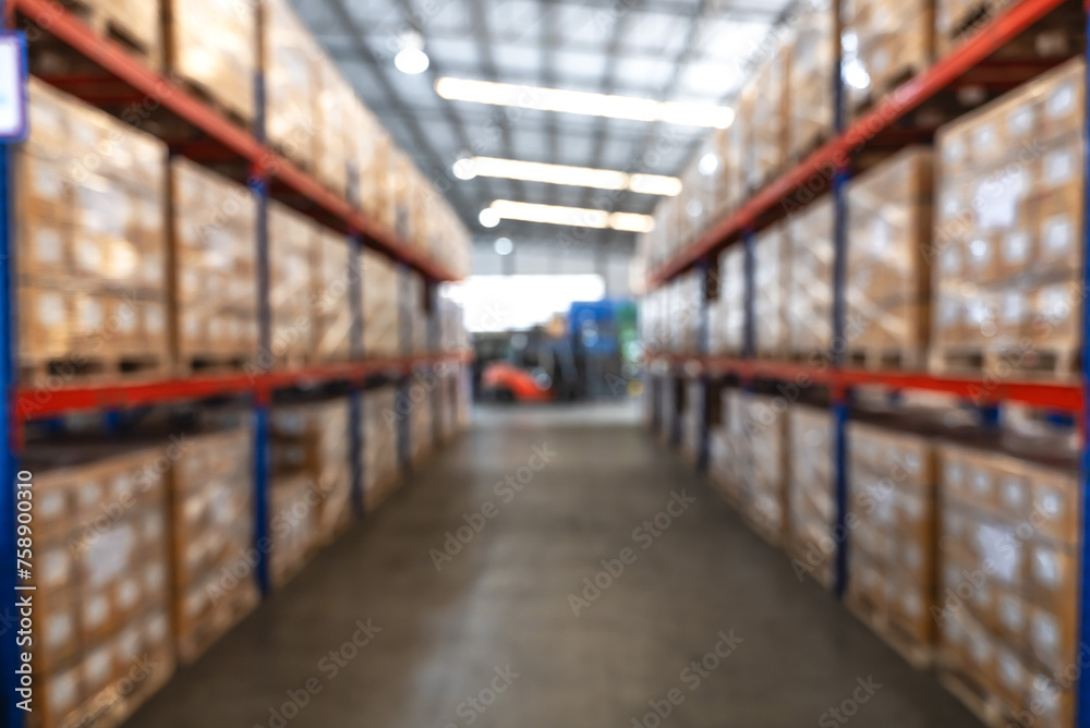 Blurred pallets on shelves in distribution warehouse background