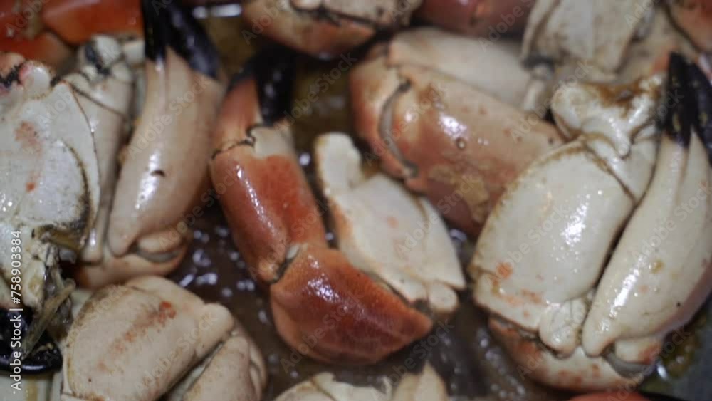 Fried crab. Crab legs in a frying pan.