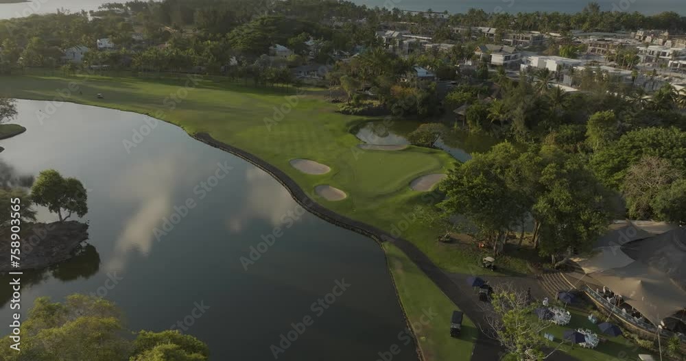 Aerial view of Winged Foot Golf Course with idyllic landscape and water reflection, Constance, Flacq, Mauritius.