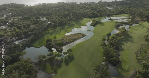 Aerial view of Constance Golf Course with lush greens and beautiful lake, Pointe de Flacq, Mauritius. photo