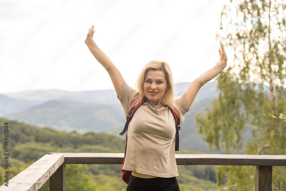 Tired middle age woman resting after hiking in nature Tired middle age woman resting after hiking in nature