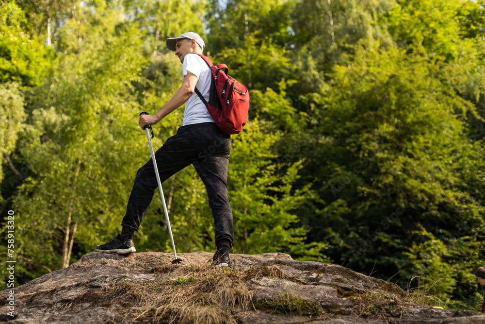 Man hiking in the mountains with a backpack Man hiking in the mountains with a backpack