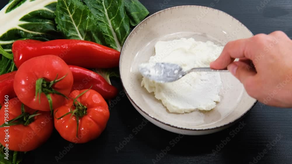 chard leaves cooked with tomatoes, onion, red pepper, served on yoghurt, process