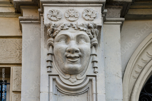 Bas-relief depicting a smiling male face at the entrance of Palazzo Roero di Guarene, Turin, Piedmont, Italy