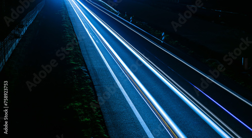 lights of cars driving at night. long exposure