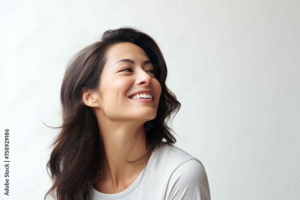 Portrait of a smiling young woman with long hair on white background Portrait of a smiling young woman with long hair on white background