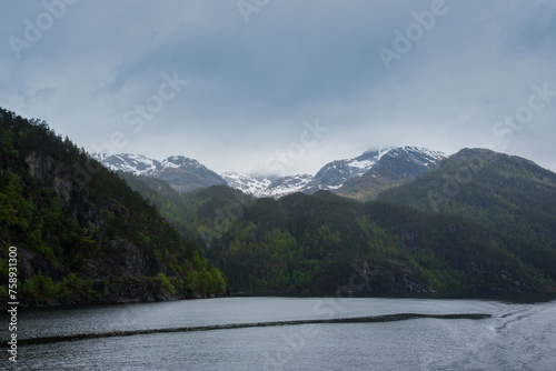 lake near the snow peak mountains 