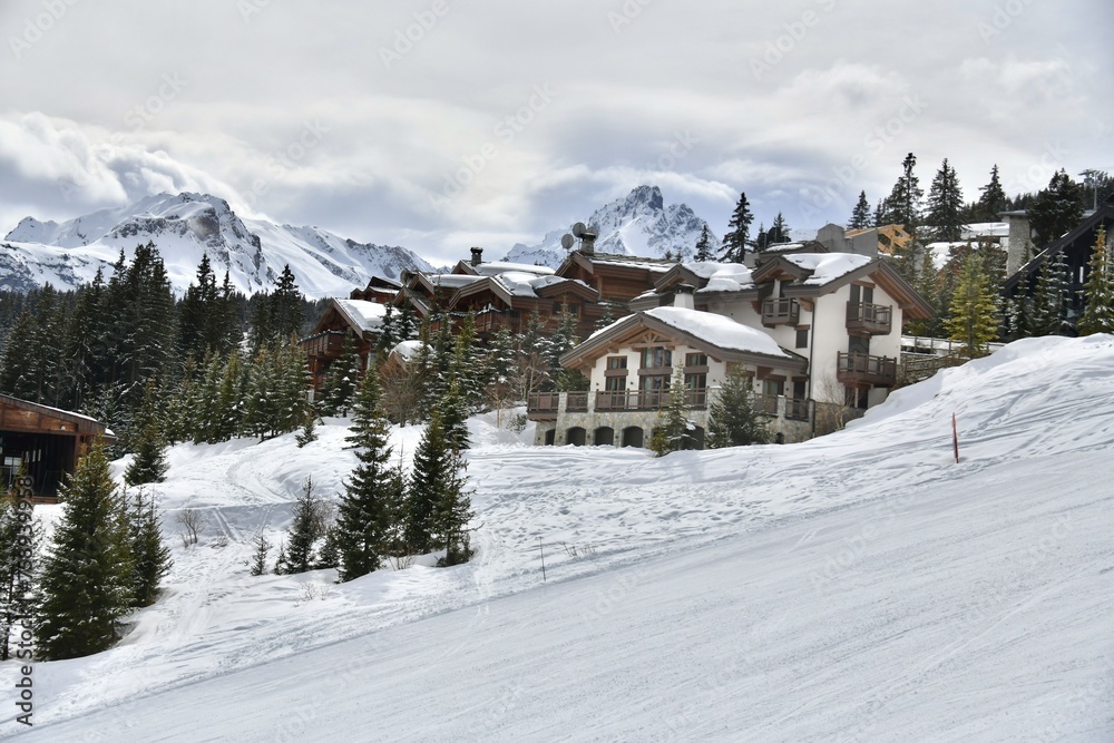 Winter scenery of ski resort Courchevel with its chalets on the slopes 