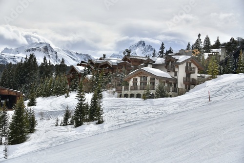 Winter scenery of ski resort Courchevel with its chalets on the slopes 