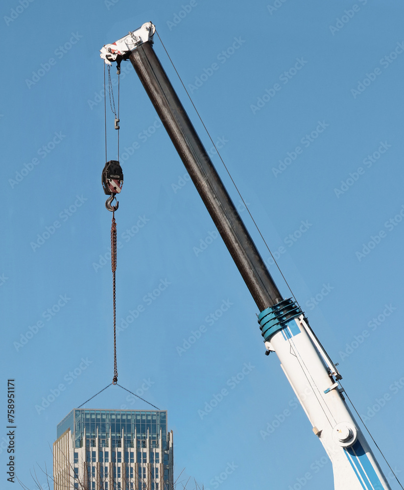 construction crane aand huge building against blue sky construction crane aand huge building against blue sky
