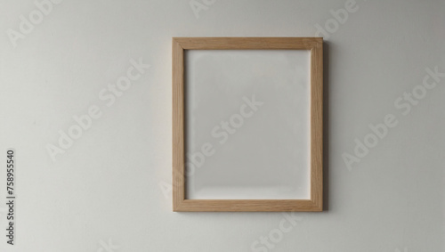 Small vertical wooden frame mockup in scandi style on empty neutral white wall background