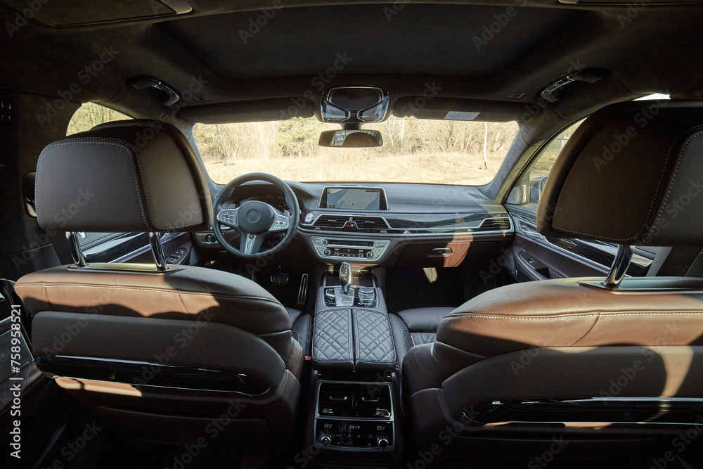 Inside moden car background, luxury car interior elements wallpaper. Black leather car interior