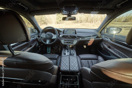 Inside moden car background, luxury car interior elements wallpaper. Black leather car interior © Studio-M
