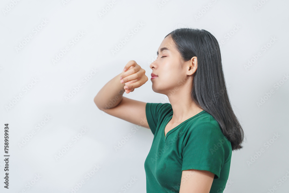 Happy and calm Asian girl is seen enjoying a pleasant aroma, taking deep breaths of fresh air in isolation. Happy and calm Asian girl is seen enjoying a pleasant aroma, taking deep breaths of fresh air in isolation.