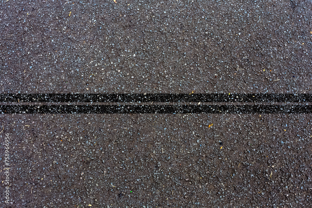 Fototapeta premium Lignes noires sur asphalte 