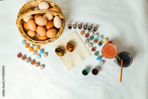 Preparation for painting Easter eggs. Paints and brushes for coloring Easter eggs