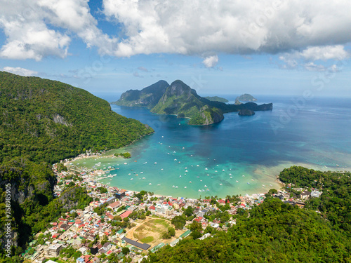 Aerial view of town in El Nido. Boats over turquoise clear sea water. Philippines.