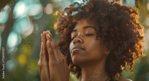Woman Praying With Closed Eyes photo