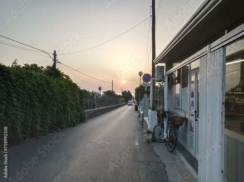 A street looking to the sunset on the Procida Island, Gulf of Naples, Italy photo