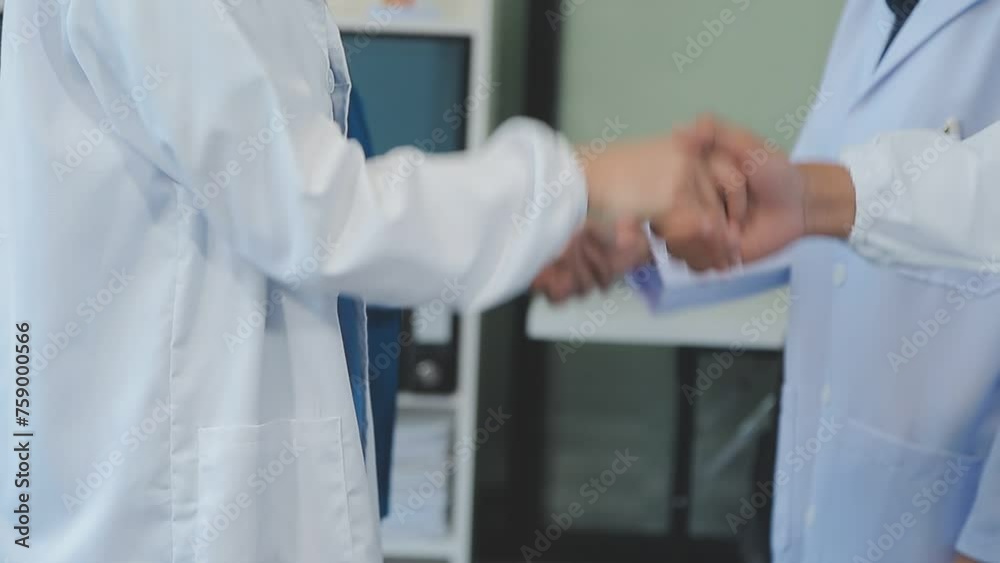 A handshake between an MR and a doctor who comes to the hospital on a sales call and shakes hands to seal the deal. Faceless scene. A handshake between an MR and a doctor who comes to the hospital on a sales call and shakes hands to seal the deal. Faceless scene.
