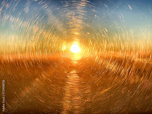 View of the sun through a circular prism scratched window