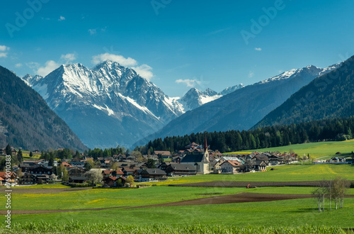 Town and valley in Austria and Alps mountains