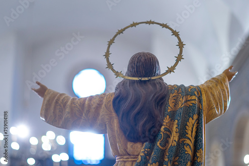 jesus christ with his back and open arms towards the light inside the Igreja Matriz de Colares Nossa Senhora da Assunção photo