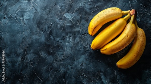 bunch of yellow bananas on dark oil paint background photo