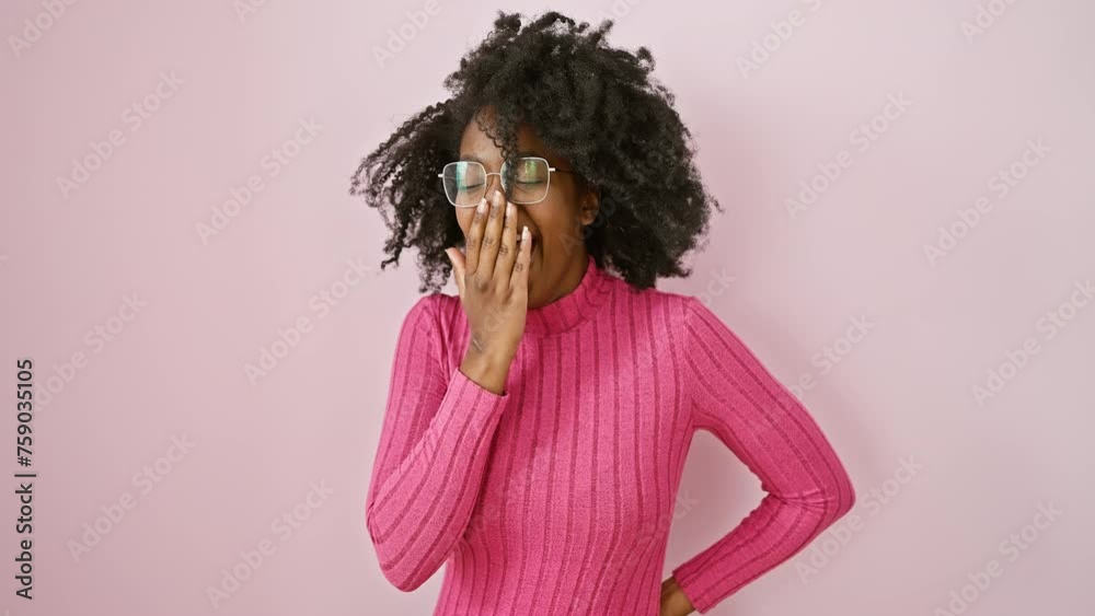 Tired african american woman yawns, bored and sleepy, standing with mouth covered by hand, wearing glasses, isolated pink background. Tired african american woman yawns, bored and sleepy, standing with mouth covered by hand, wearing glasses, isolated pink background.