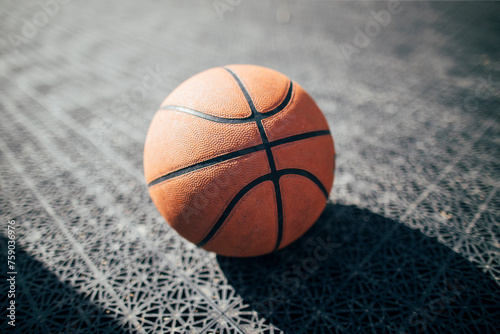 Basketball ball on the gray surface © yossarian6