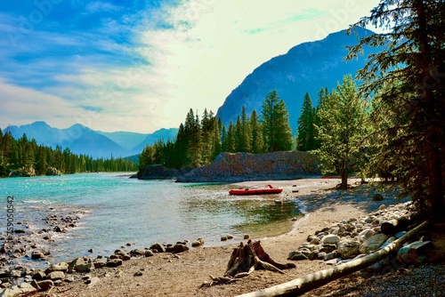 Beached Canoe on the banks of the Bow River in Banff Alberta Canada