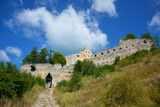 ruiny zamku na górze, castle, ruins of a castle on a hill against the blue sky 