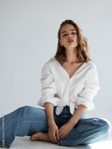 Beauty and fashion . Beautiful brown haired with stylish hairstyle. Woman with a curly hair. Beautiful young woman . Closeup portrait of an attractive girl with a brown makeup. 