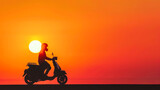 Person rides a scooter against a vibrant orange sunset background