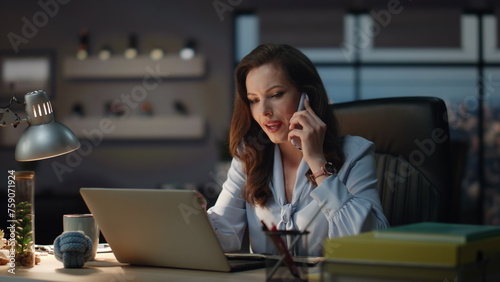 Office worker staying late discussing at night cabinet. Business woman calling