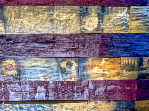 Old oak boards stained red and blue in a pattern for a background