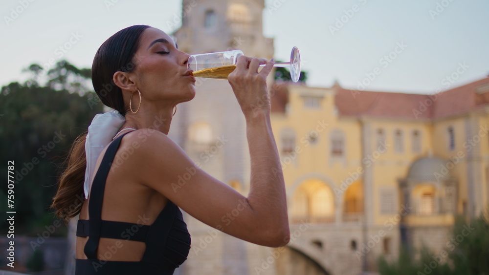 Αυτοκόλλητο Beautiful woman sipping wine looking on medieval castle outdoors close up