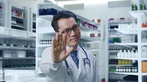 Wallpaper Mural Close Up Of Asian Male Doctor With Stethoscope Making Stop Gesture While Standing In Pharmacy Torontodigital.ca
