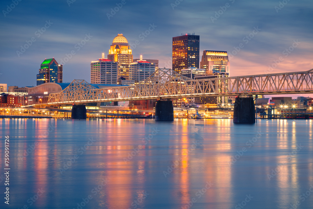 Louisville, Kentucky, USA. Cityscape image of Louisville, Kentucky, USA downtown skyline with reflection of the city the Ohio River at spring sunset.