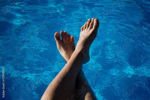 Anonymous body part leg swimming pool water relax freshen up chill out