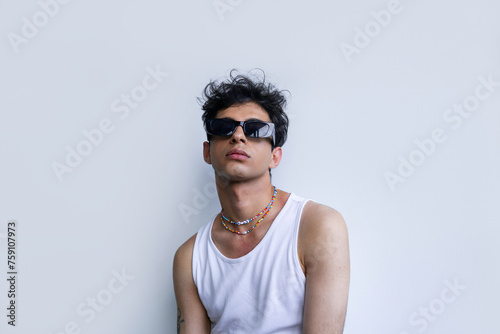 Young Hispanic man in trendy sunglasses  photo