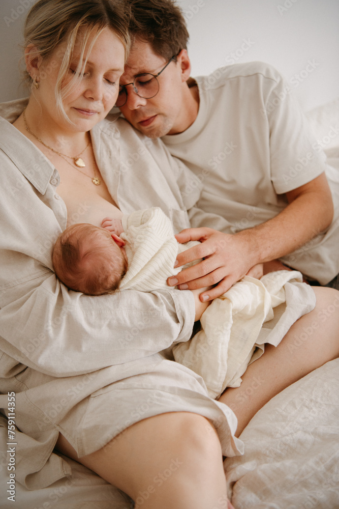 Precious moment between newborn and her parents Precious moment between newborn and her parents