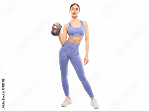 Slim, bodybuilder girl in a lilac tracksuit, lifts a heavy weight, cardio workout. Sports concept, fat burning and healthy lifestyle.