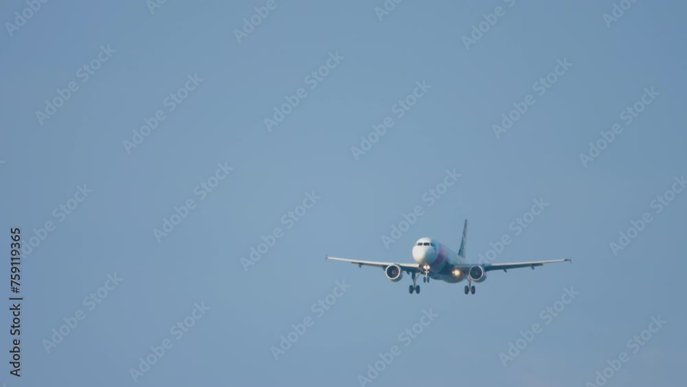Jet airplane landing at Phuket airport. Passenger plane descending, arriving. Airliner flies Jet airplane landing at Phuket airport. Passenger plane descending, arriving. Airliner flies