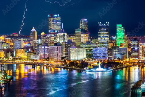 Pittsburgh downtown skyline by night. Located at the confluence of the Allegheny, Monongahela and Ohio rivers, Pittsburgh is also known as Steel City, for its more than 300 steel-related businesses
