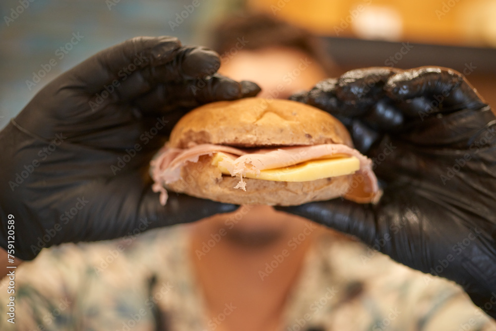 Close-up Front View of a Person Eating a Sandwich