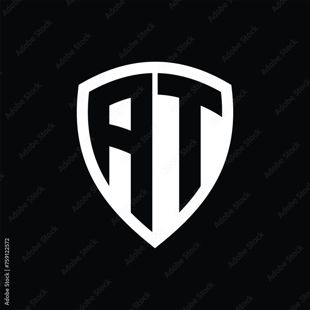 AT monogram logo with bold letters shield shape with black and white color design AT monogram logo with bold letters shield shape with black and white color design