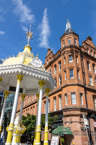 exterior facade of Bittles Bar next to The Jaffe Memorial Fountain located in Victoria Square, the shopping center and the flatiron and the Albert Memorial Clock, Belfast, Northern Ireland. photo