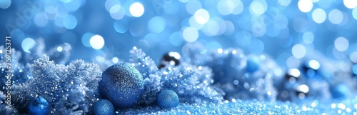 Abstract blue background with highlights and bokeh, reminiscent of frosty winter air or a starry sky. Concept: background for events related to cold, space or the magic of winter. Banner, copy space