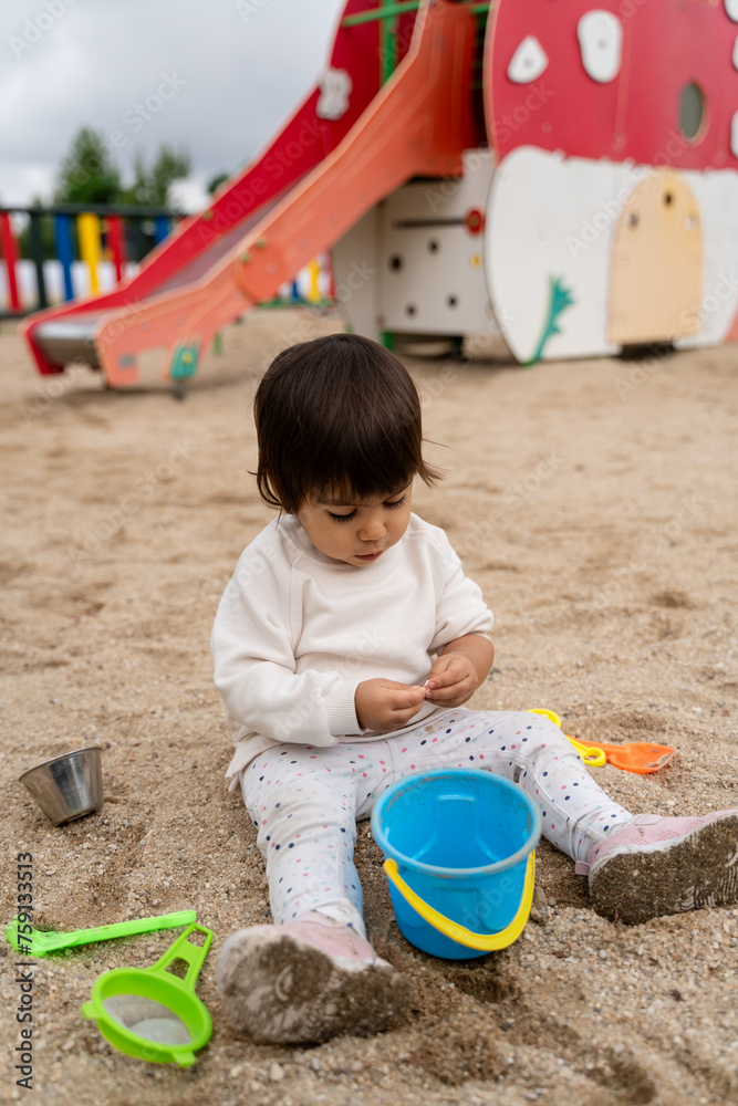 Toddler Playing in a Sunny Outdoor Playground Toddler Playing in a Sunny Outdoor Playground
